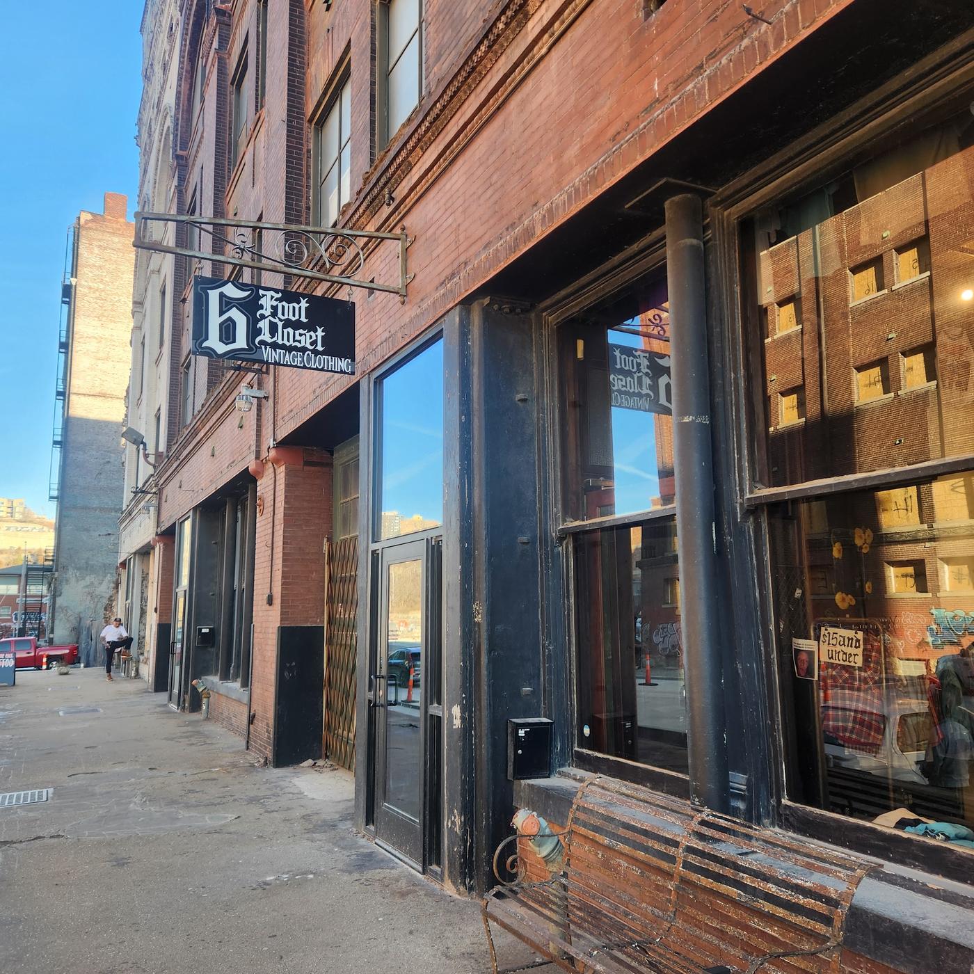 The 6 Foot Closet storefront on Mulberry Street, red brick with black framed display windows